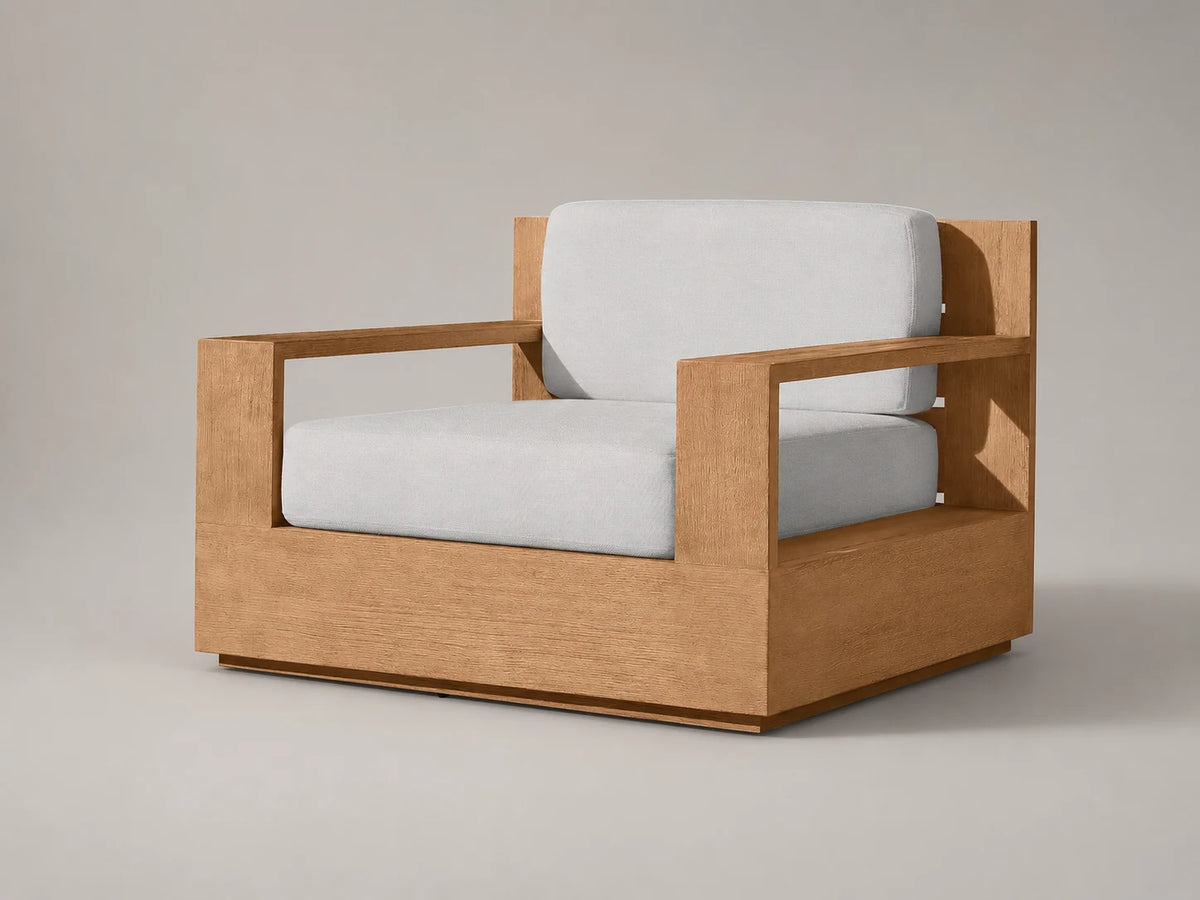 Outdoor teak lounge chair, three-quarter view