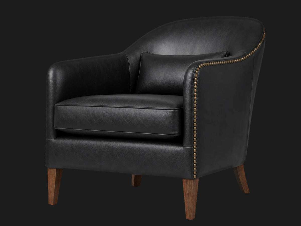 prod2702072 lounge chair 45-degree view in Costa Leather Jet and Walnut Vintage
