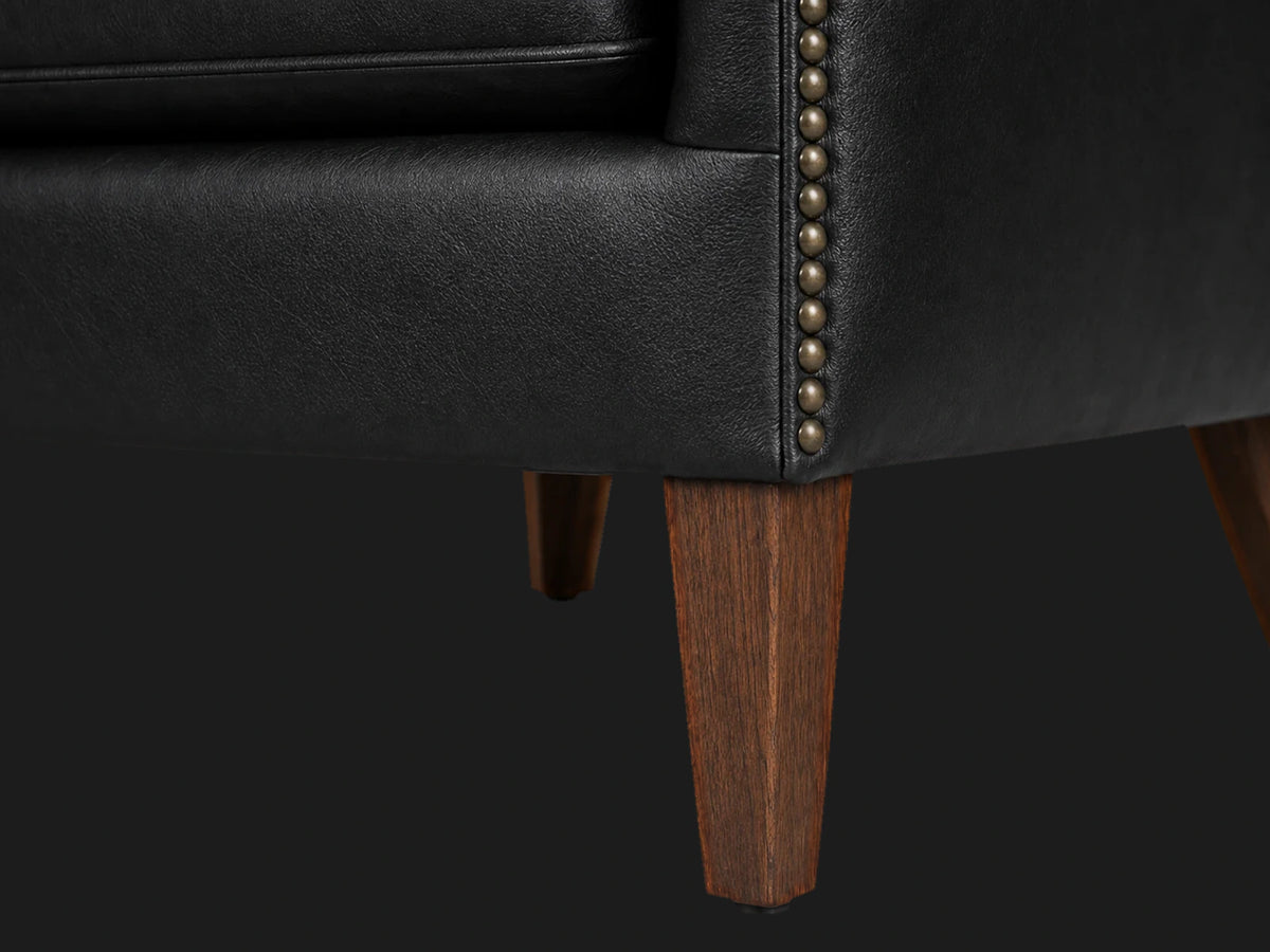 prod2702072 lounge chair leg detail in Costa Leather Jet and Walnut Vintage