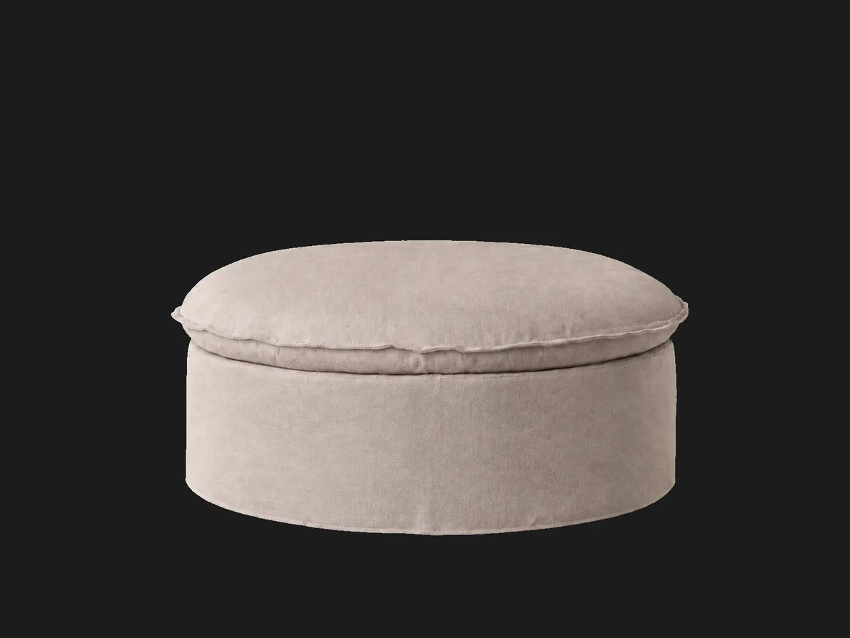 Neva Round Storage Ottoman in Performance Linen Weave Beige — elevated three-quarter view