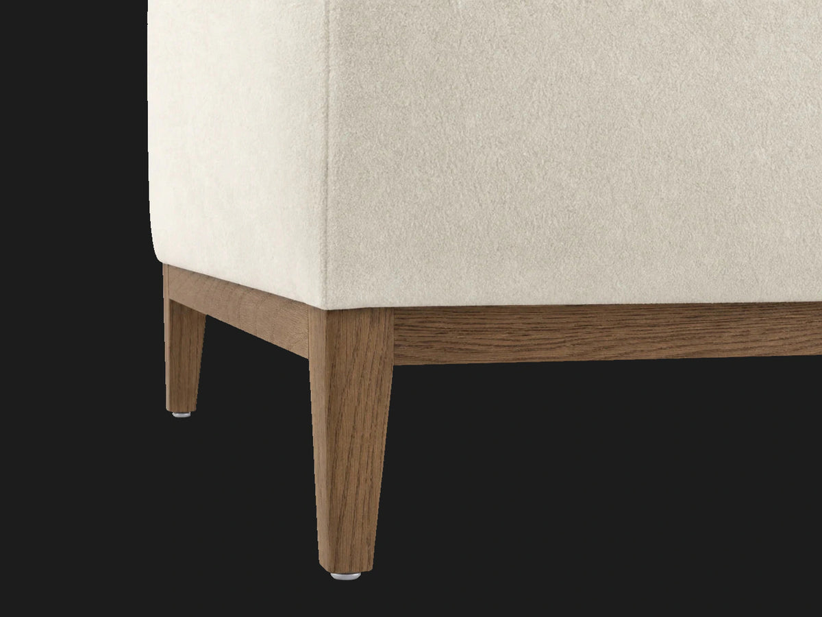 E310952588 sofa detail oak base leg view in Italian Brushed Wool Vanilla with oak base
