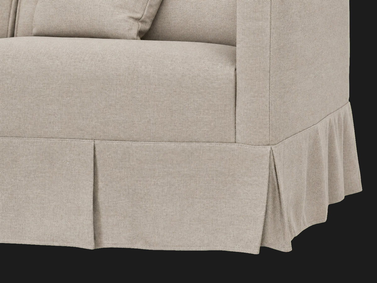 Dalia Sectional — pleated skirt detail in Performance Textural Weave Earthen