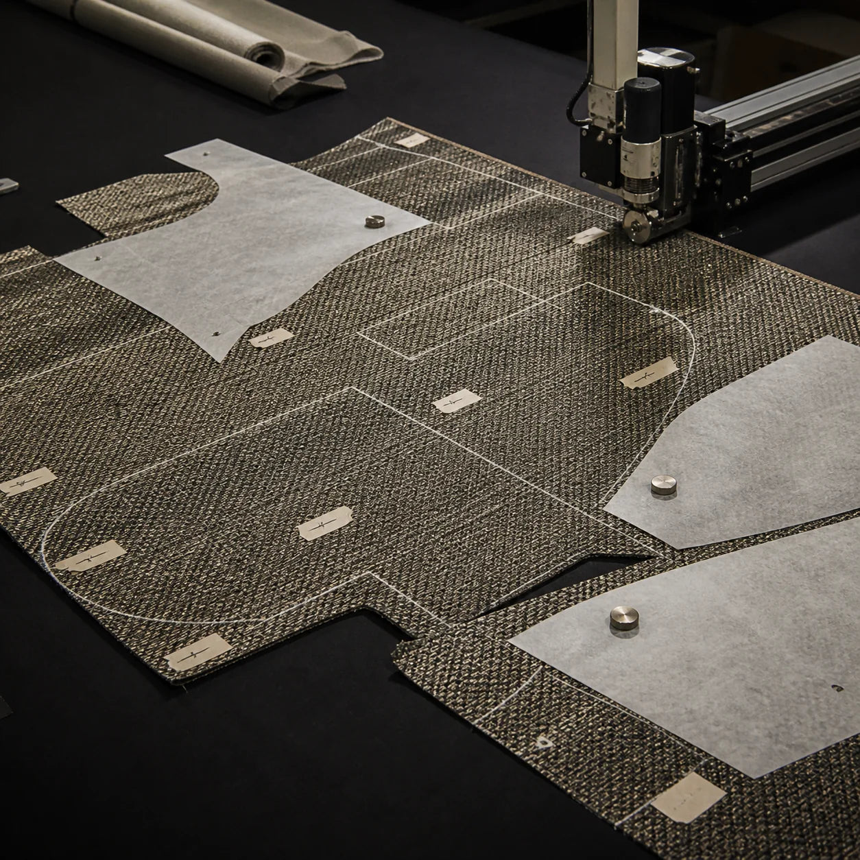 Upholstery pattern layout and precision fabric cutting