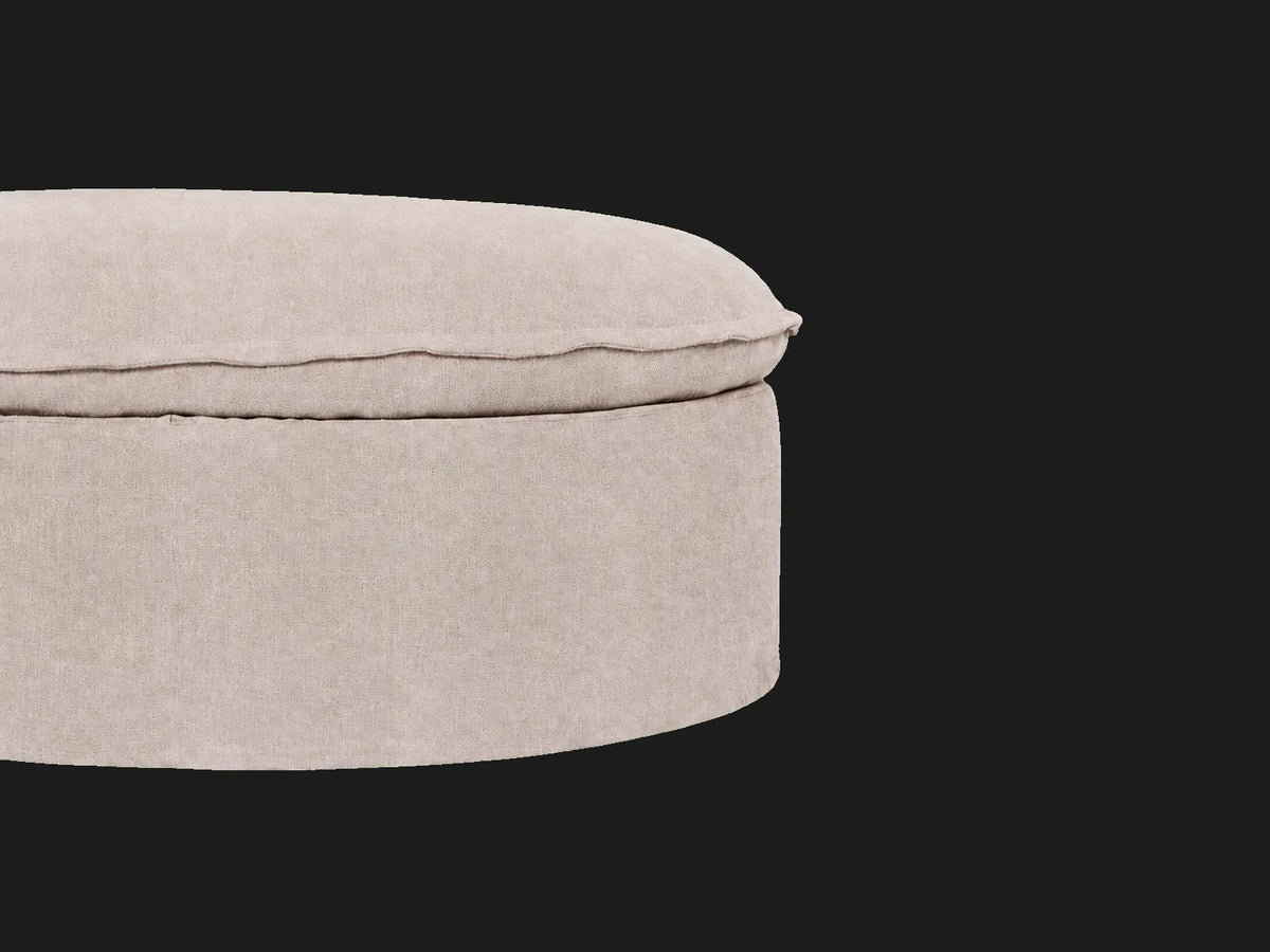 Neva Round Storage Ottoman — upholstered side and flange-seam detail