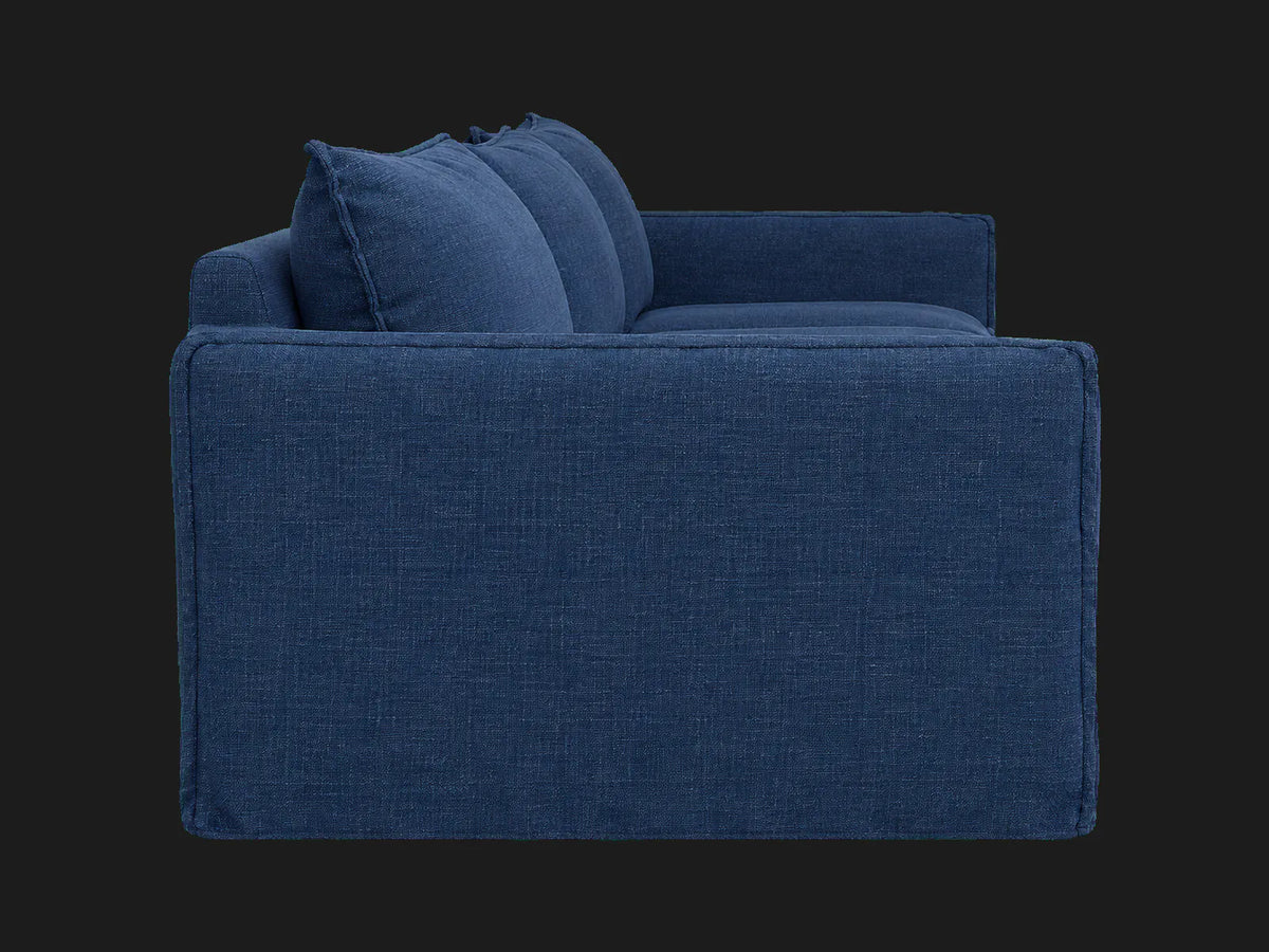 Neva Slipcovered Modular Sectional Sofa in Performance Linen Weave Bay — deep side view