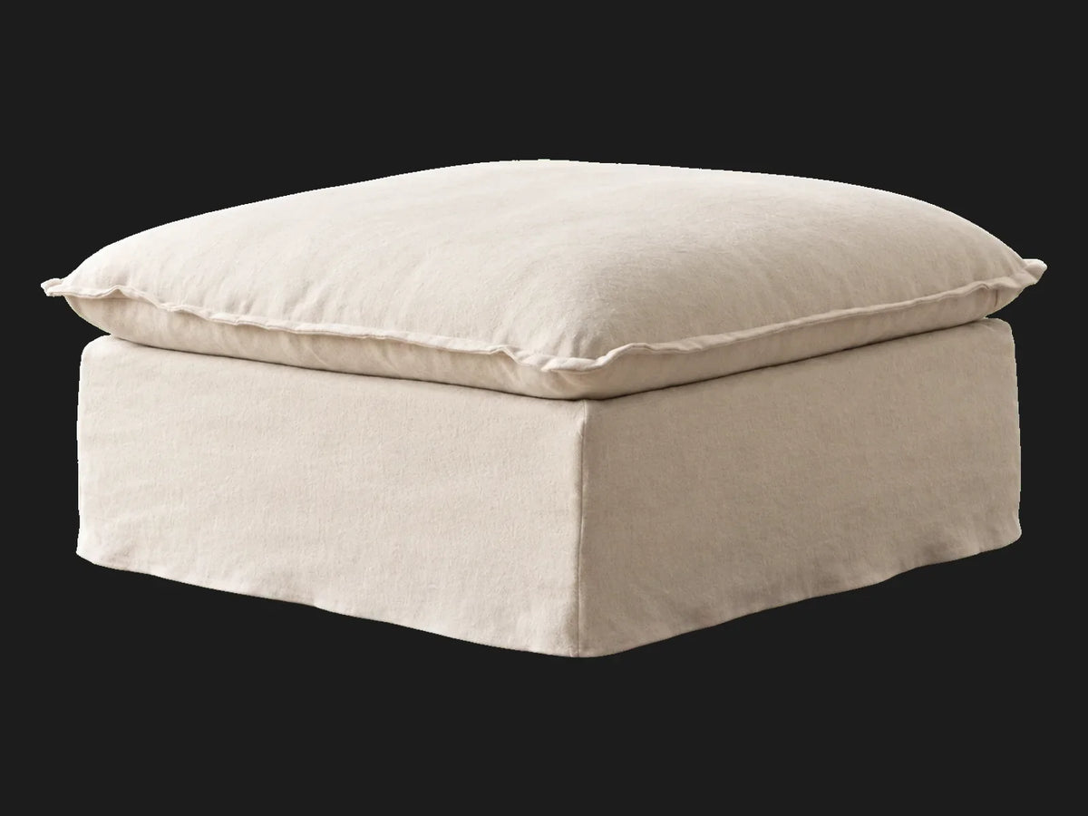 Neva Storage Ottoman in Italian Brushed Wool Vanilla, skirted three-quarter view