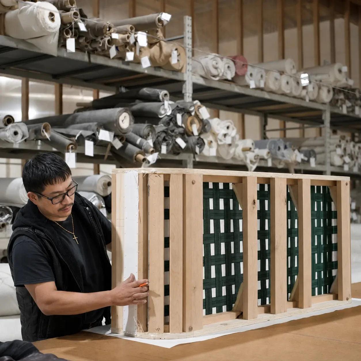 Furniture frame support webbing and fabric storage scene in a workshop