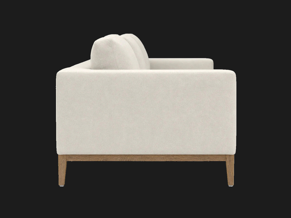 E310952588 sofa side view in Italian Brushed Wool Vanilla with oak base