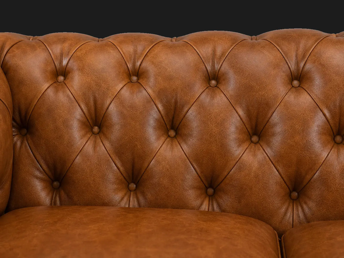 Chesterfield sofa tufting detail in cognac leather