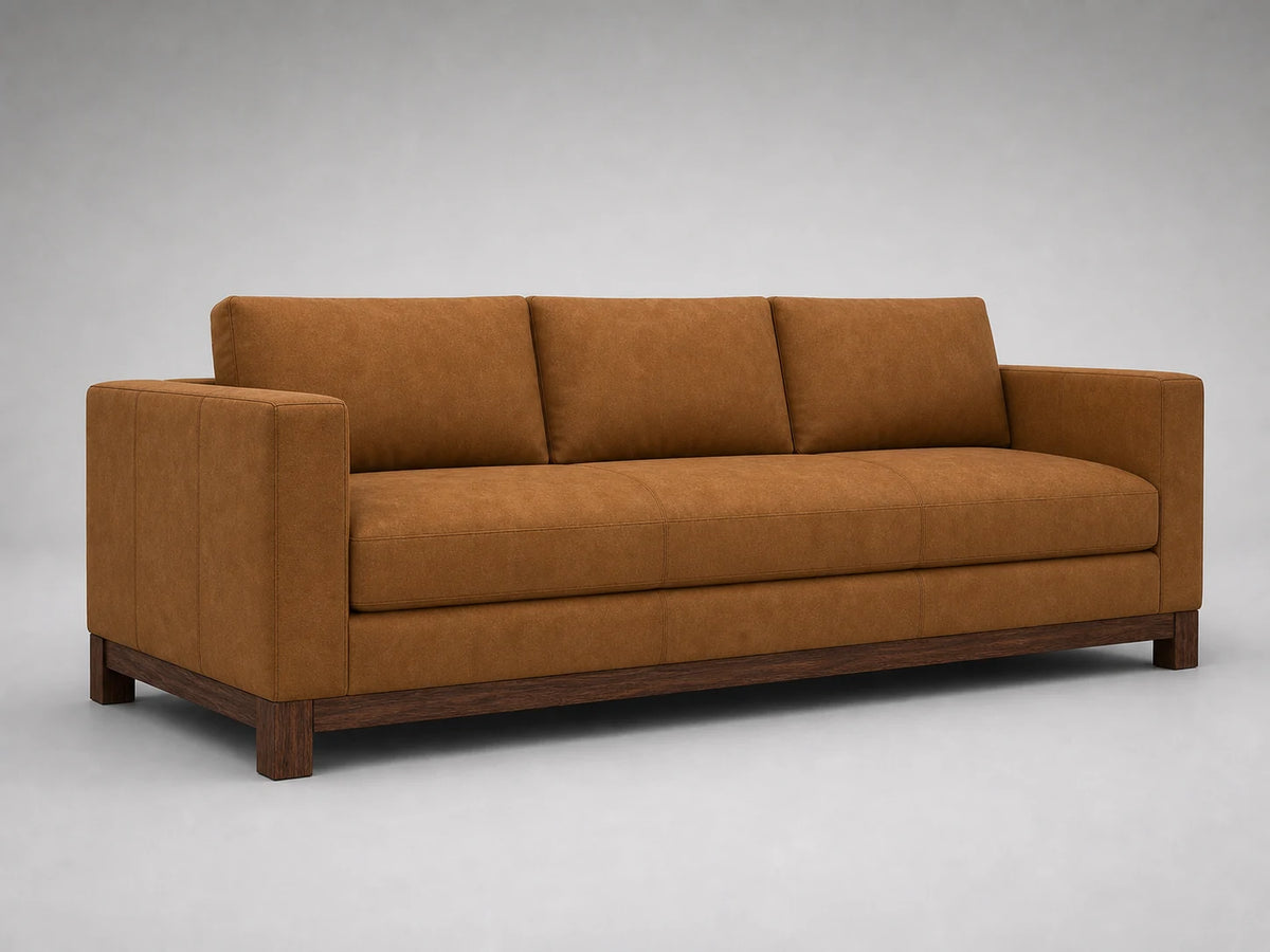Jake sofa 45 degree left view in Nubuck Leather Saddle with walnut finish