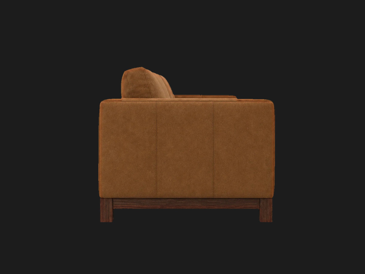Jake sofa side view in Nubuck Leather Saddle with walnut finish